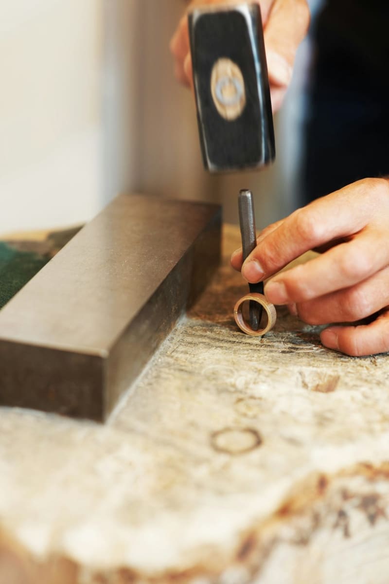 a ring being shaped on a bench block