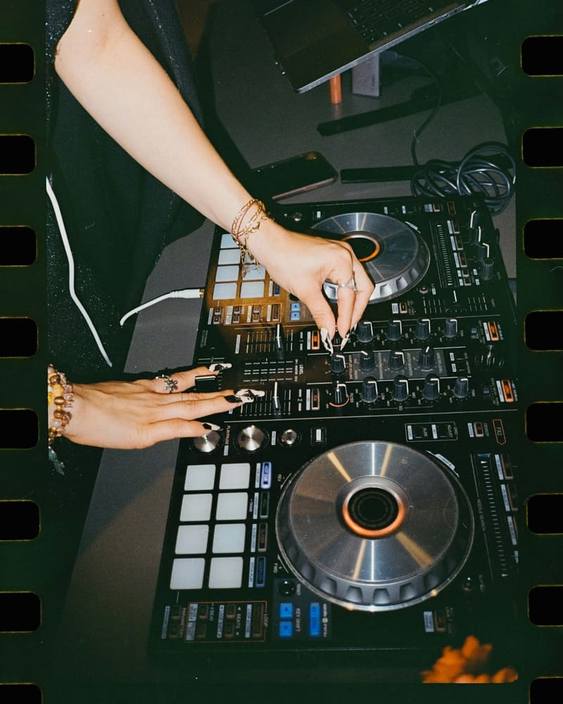 hands on a DJ controller