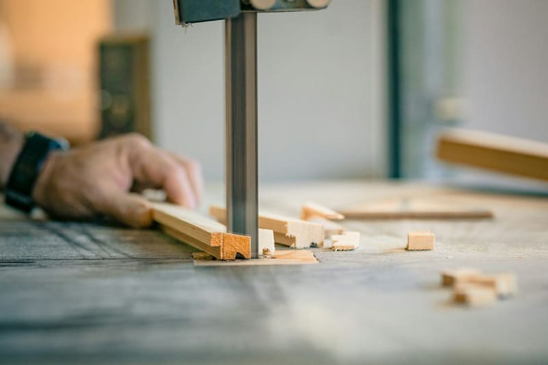 a bandsaw cutting timber