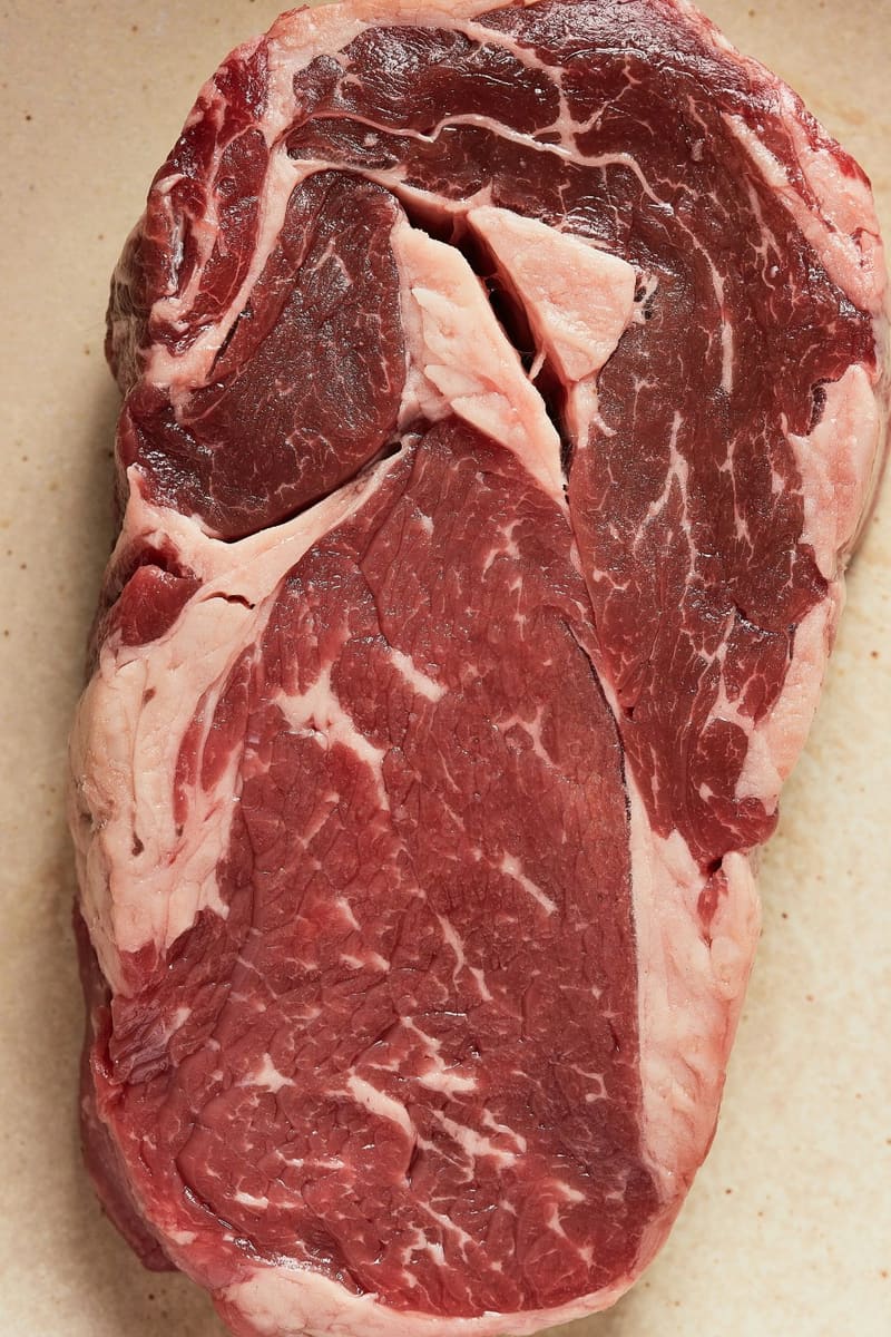 a raw ribeye steak