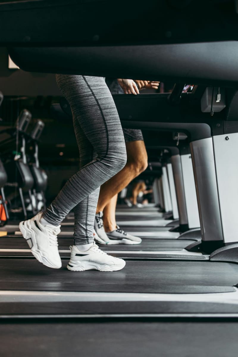 legs running on a treadmill
