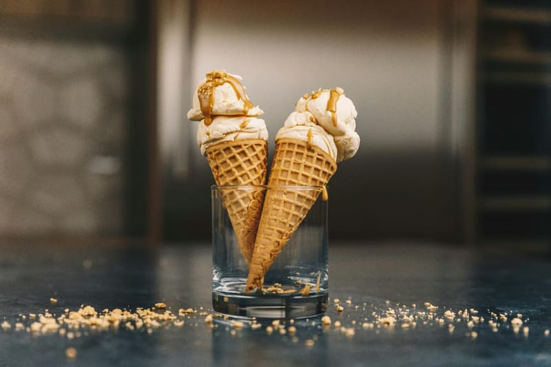 two caramel cones in a glass