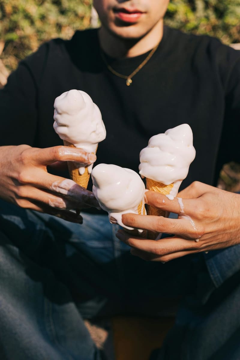three soft serve cones held up