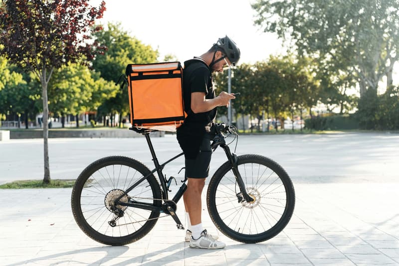 a courier with a delivery backpack