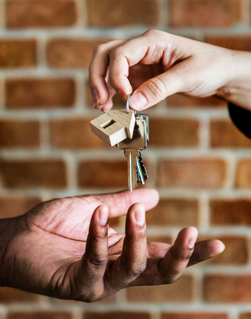 keys handed from one hand to another