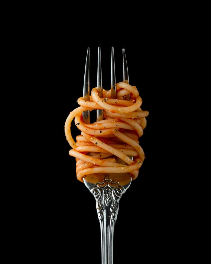 spaghetti in tomato sauce on a fork