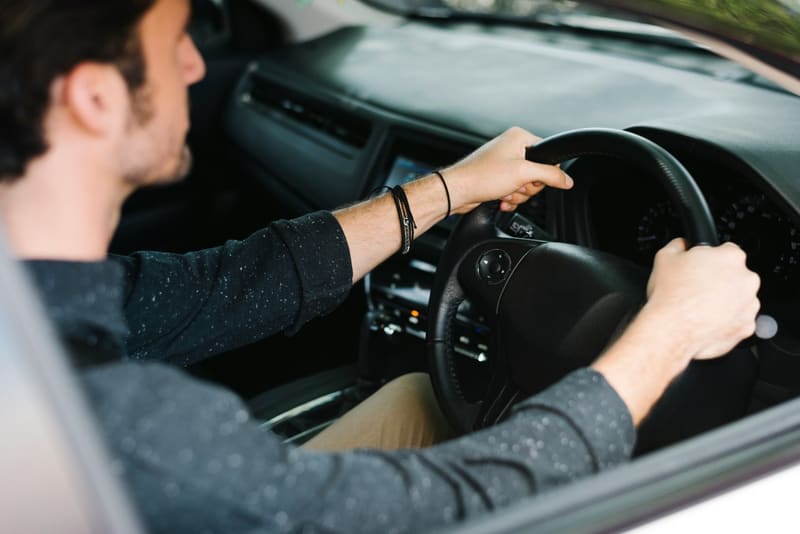 a man driving a car