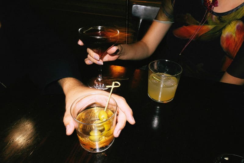 cocktails on a dark bar top