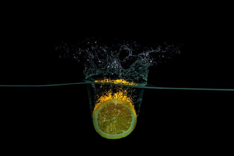 a lemon slice dropped into water