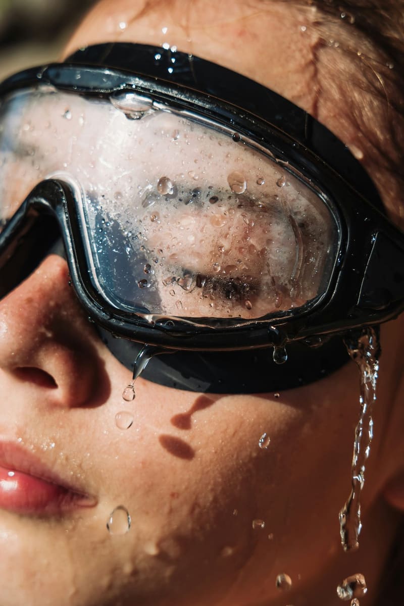 a swimmer in wet goggles