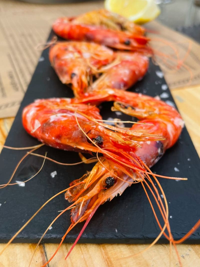 grilled red prawns on slate