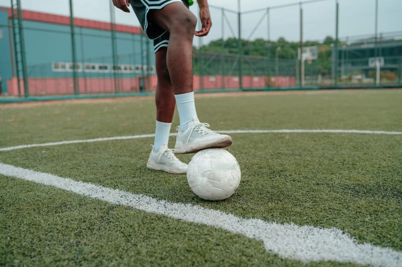 a foot resting on a football