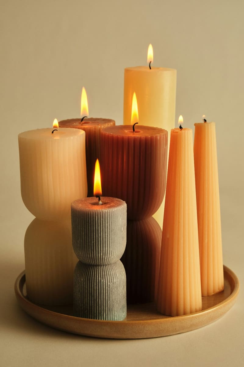 a group of lit pillar candles