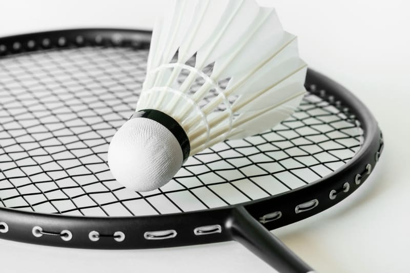 a shuttlecock on a badminton racket