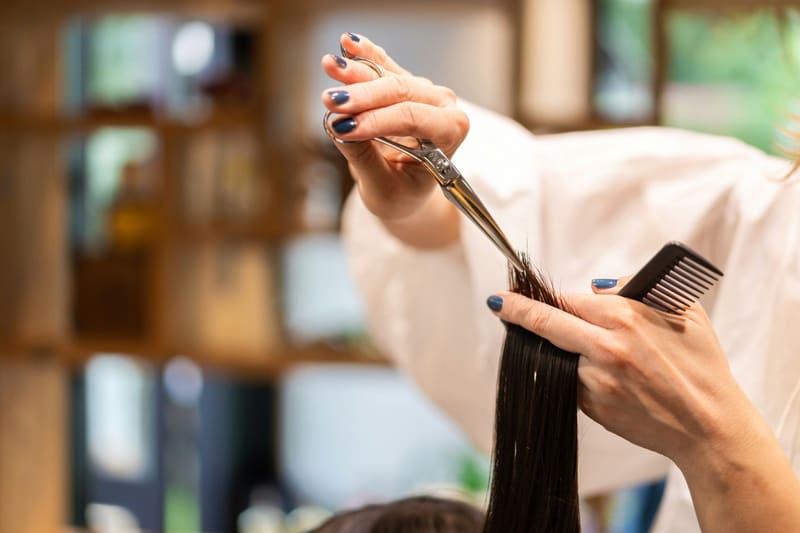 scissors trimming the ends of hair