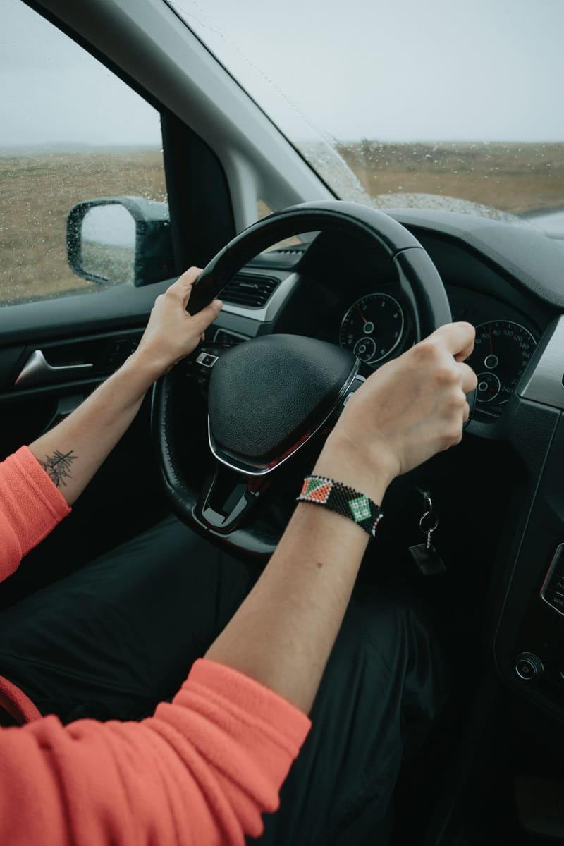 hands on a steering wheel