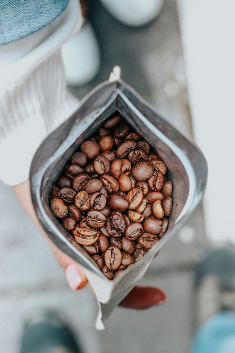 an open bag of roasted coffee beans