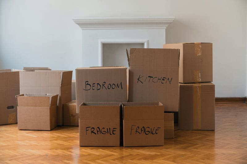 labelled moving boxes on a floor