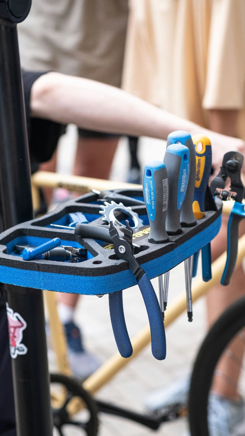 a tray of bicycle tools