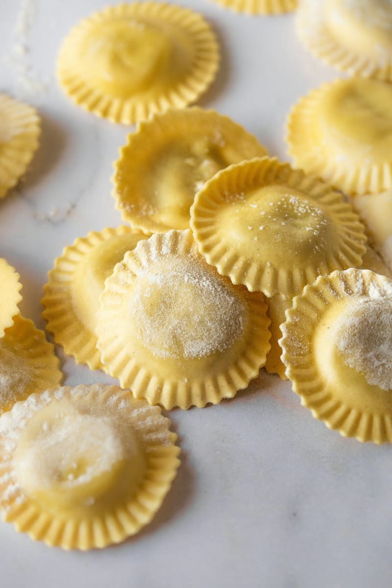 round ravioli dusted with flour