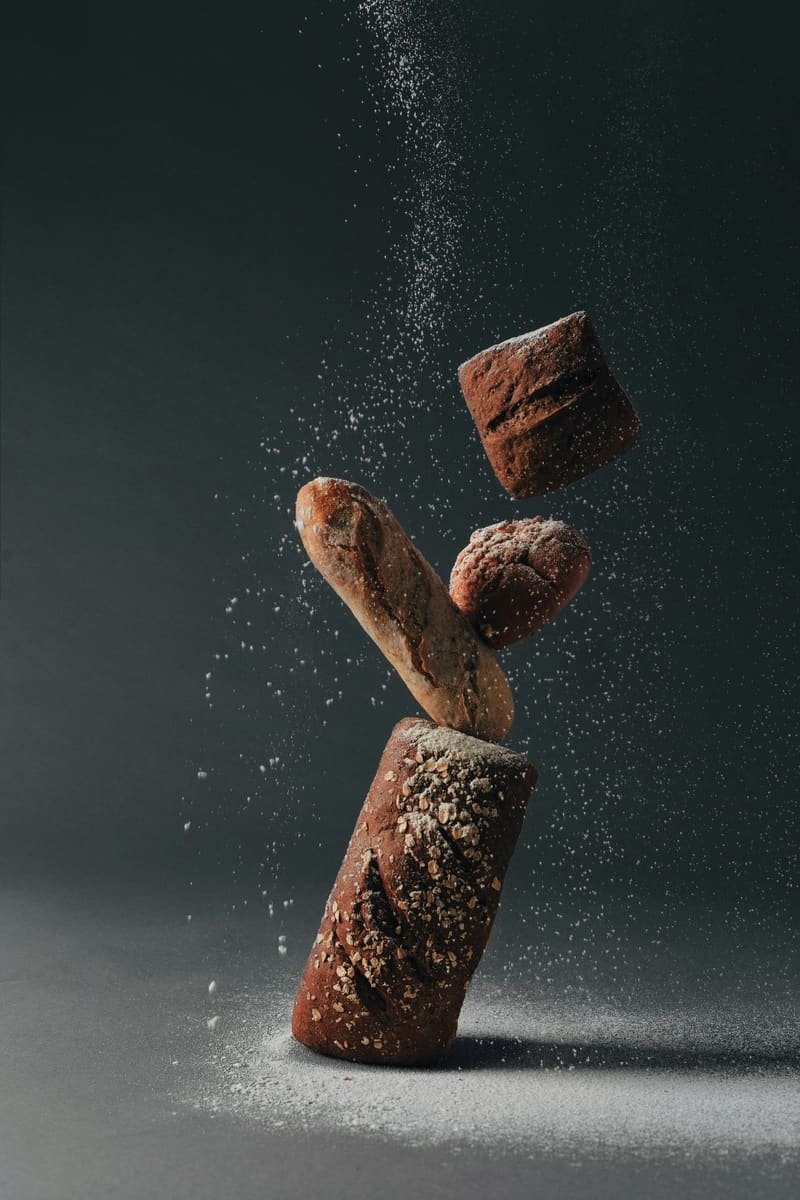 loaves of bread and falling flour