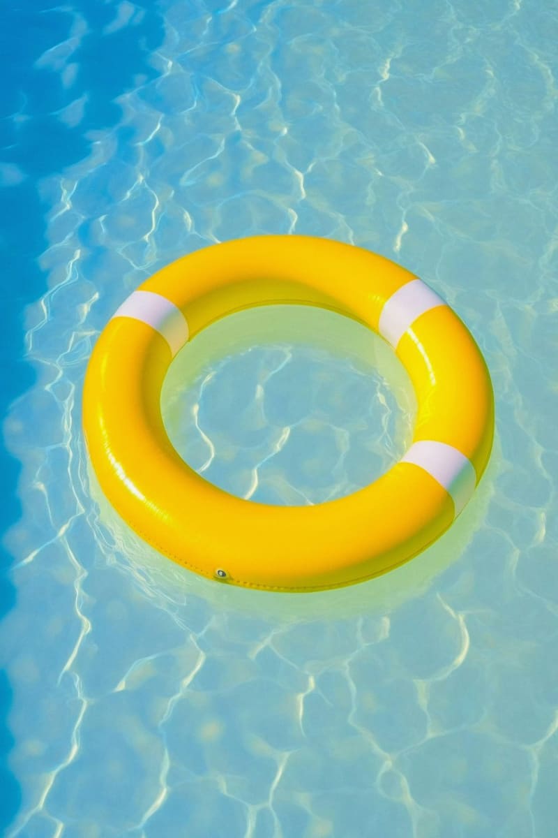 a yellow ring float in a pool