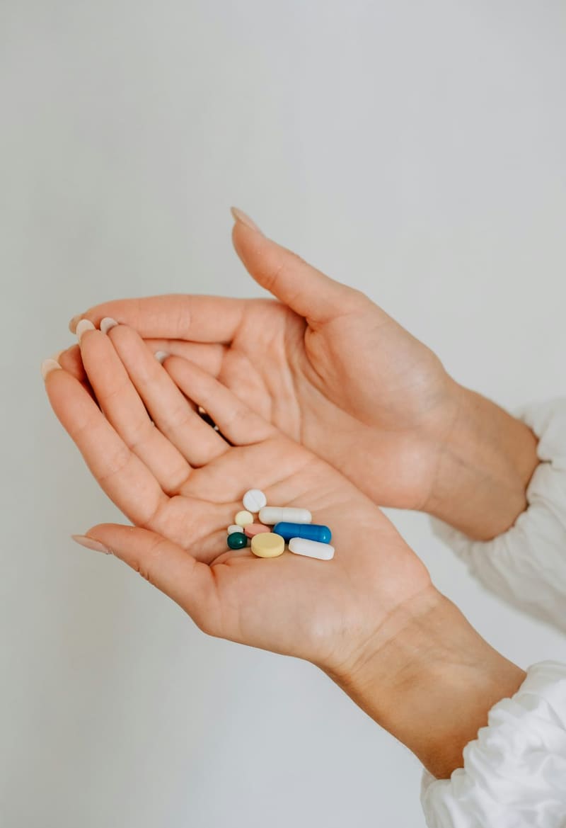 a palm holding a handful of pills