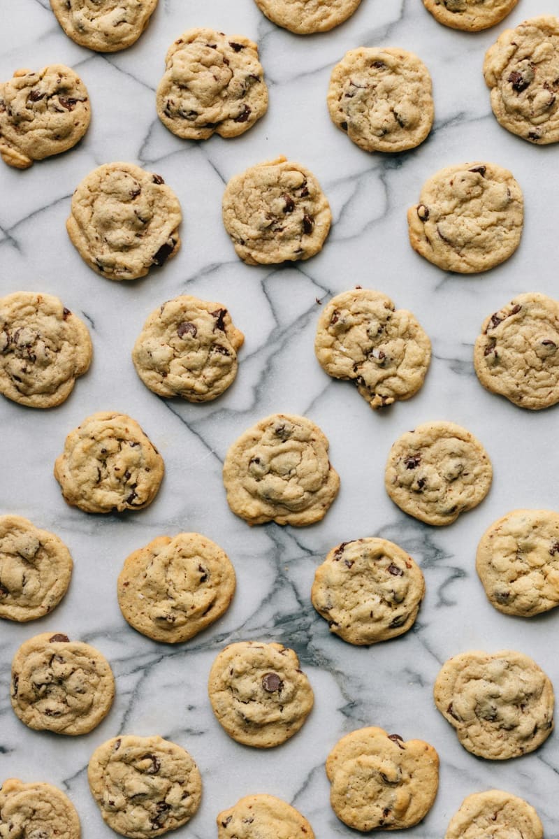 a batch of cookies on marble