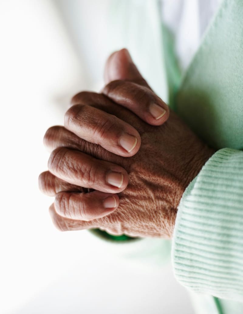 an older person's folded hands
