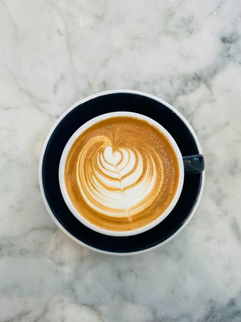 a flat white on marble