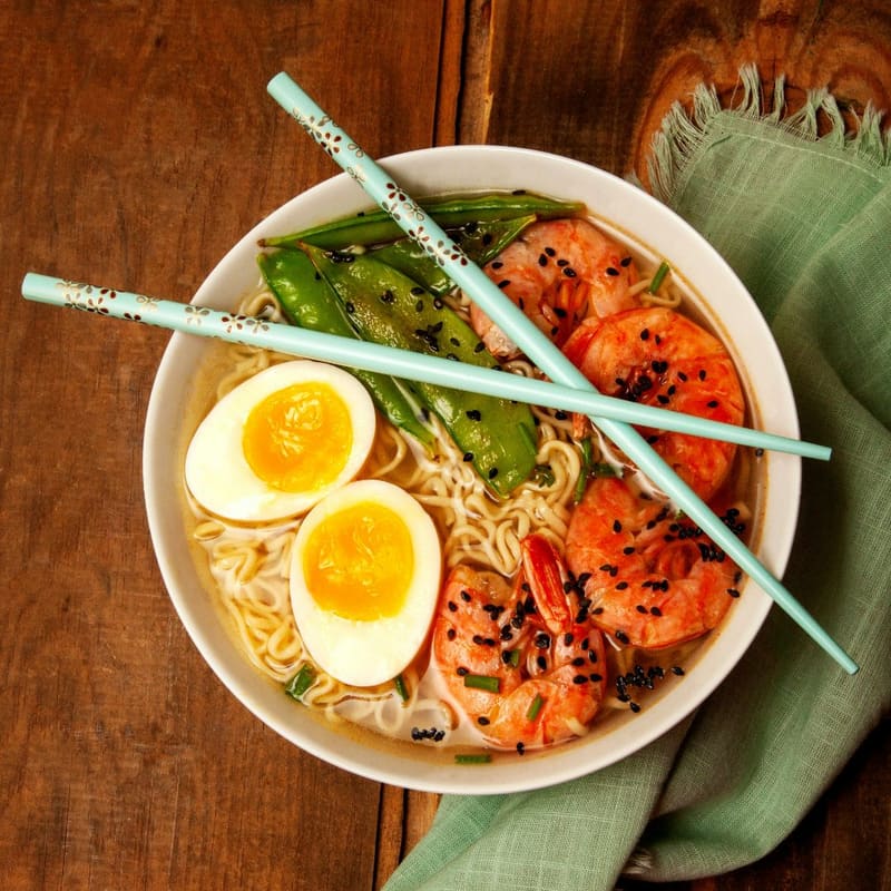 a bowl of prawn ramen from above