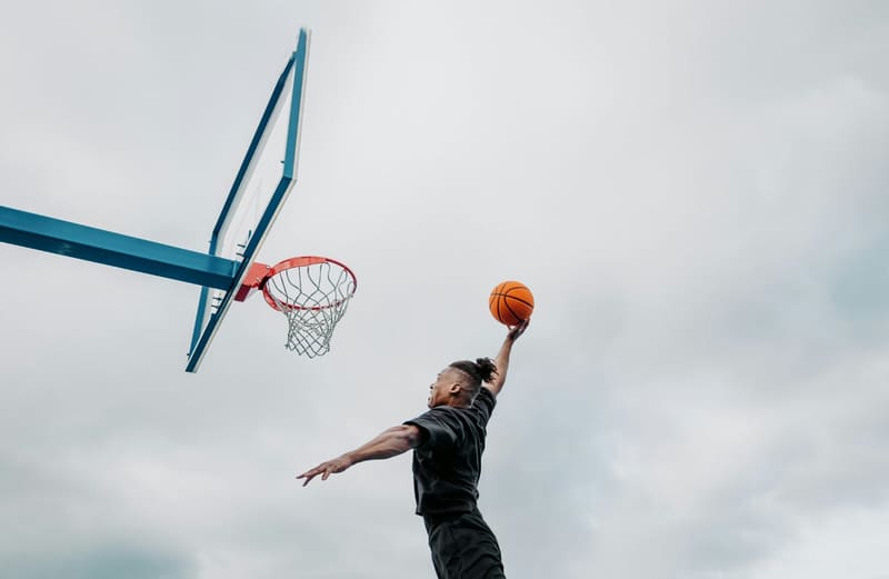 a basketball player dunking