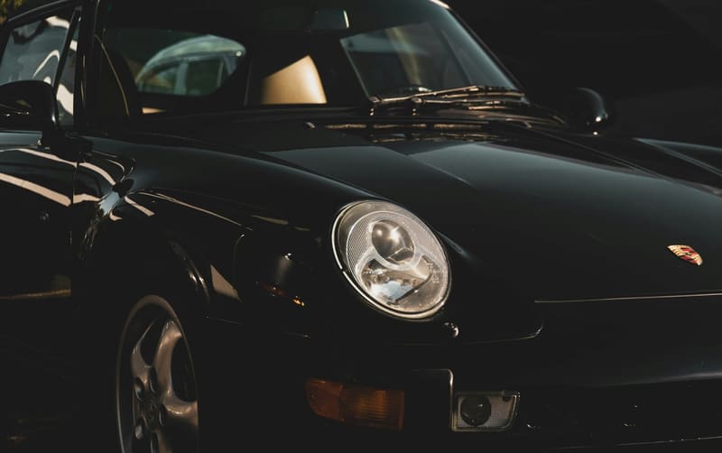 the headlight of a classic porsche