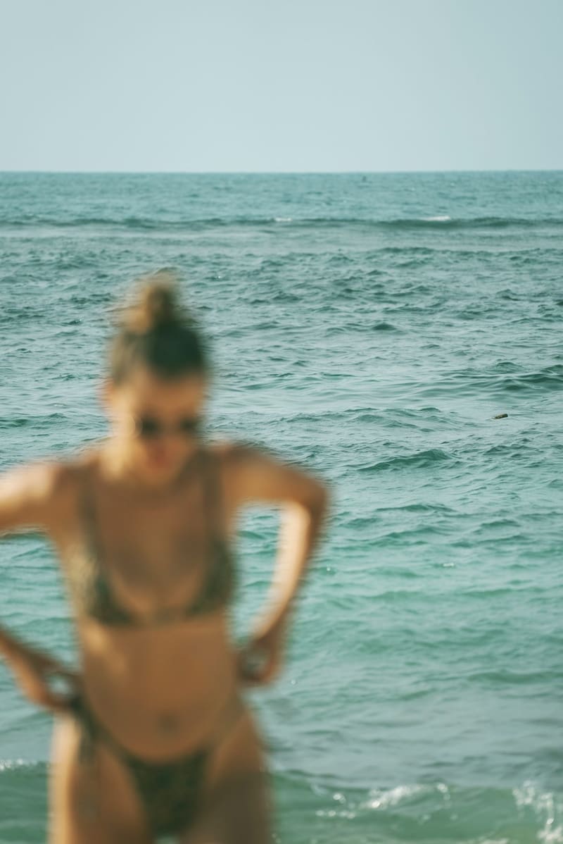 a woman standing in the sea