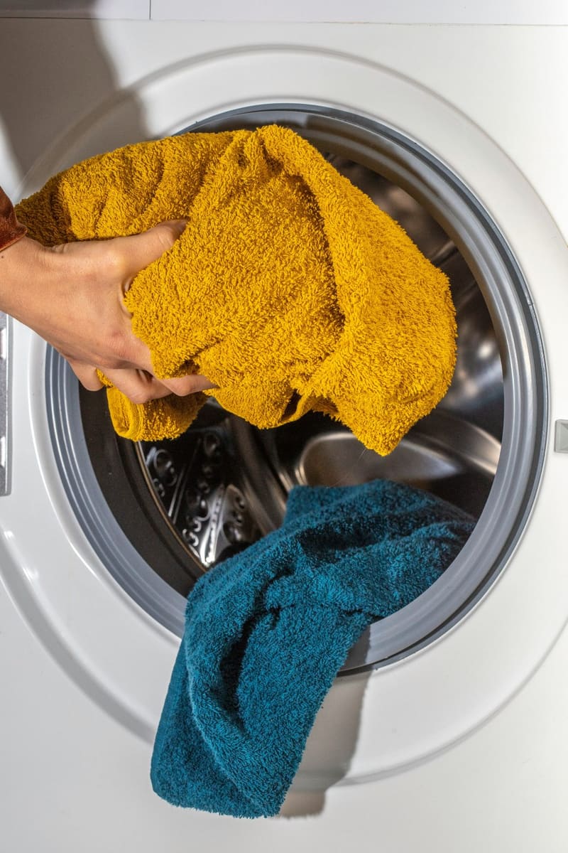 towels loaded into a washing machine