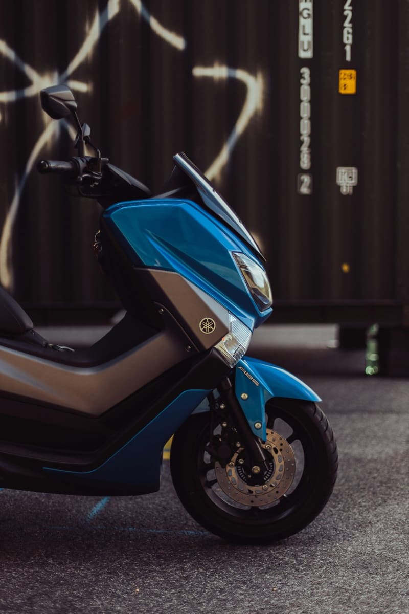 a blue and grey motor scooter