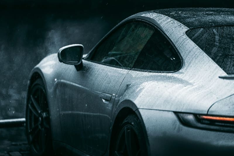 a wet sports car in the dark