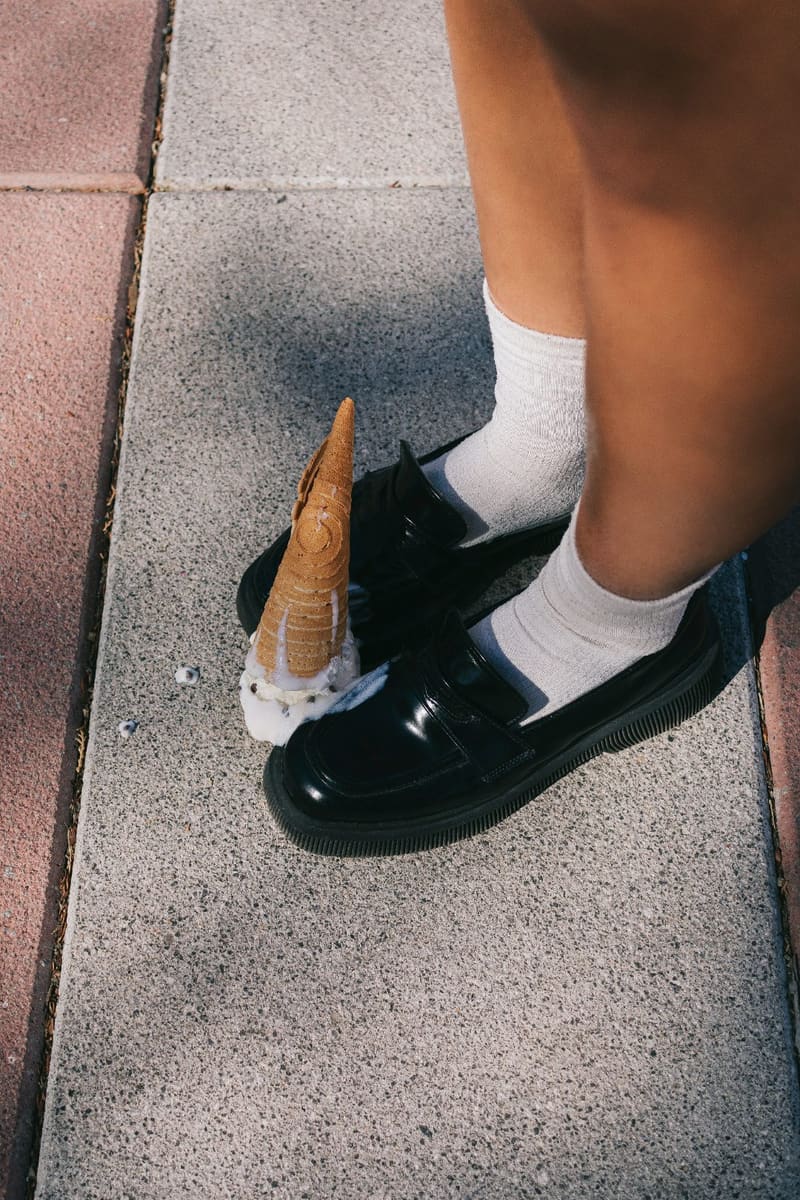 a dropped ice cream cone by a shoe