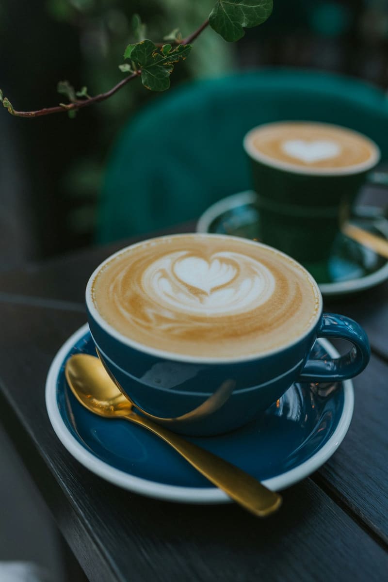 a cappuccino in a blue cup