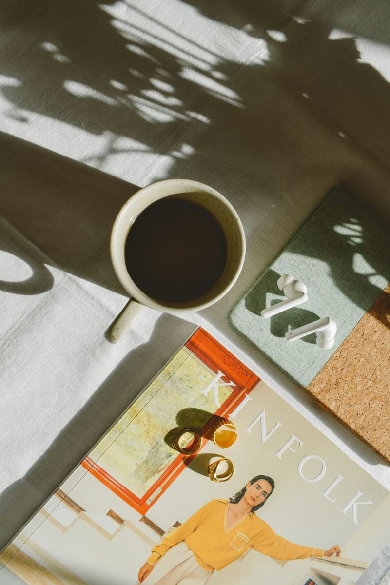 a cup of coffee on a magazine