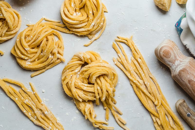 hand cut pasta on a bench