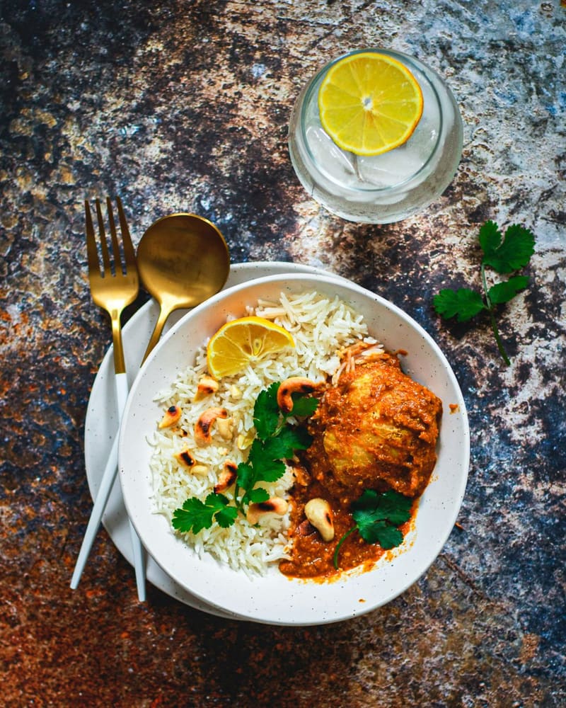 a curry with rice on a plate