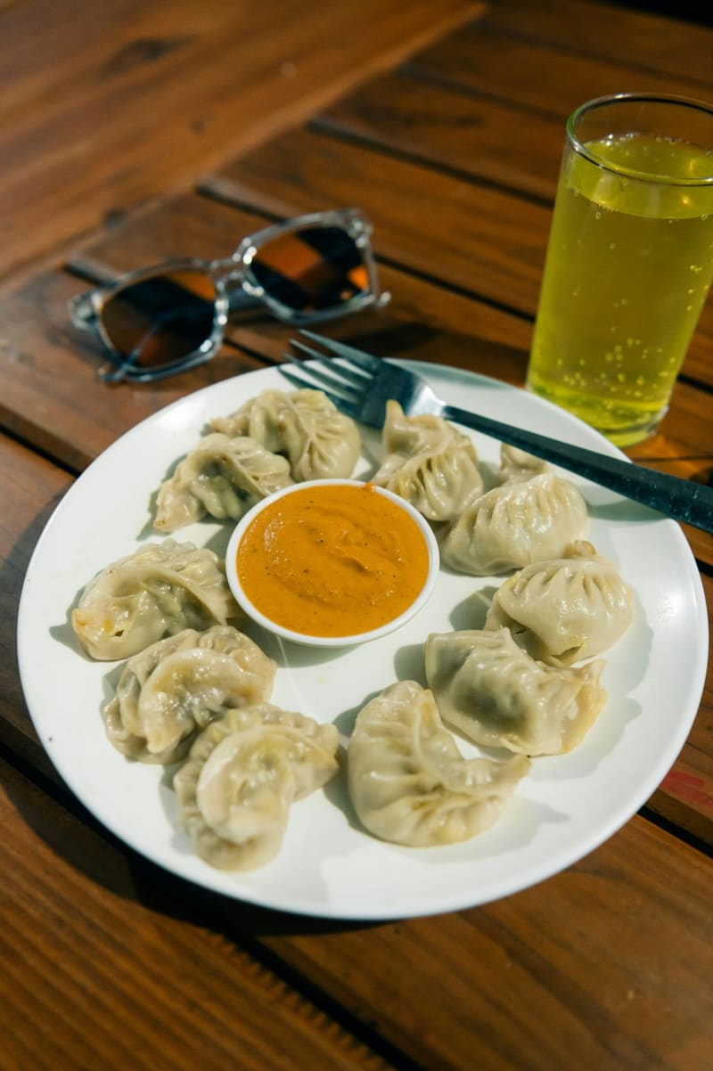 a plate of steamed momo dumplings