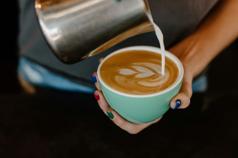 milk poured into a latte