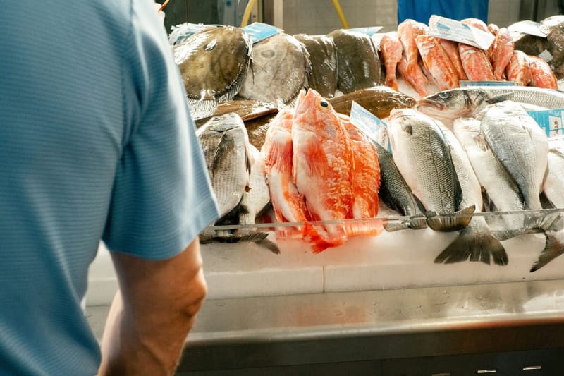 a fishmonger counter of whole fish