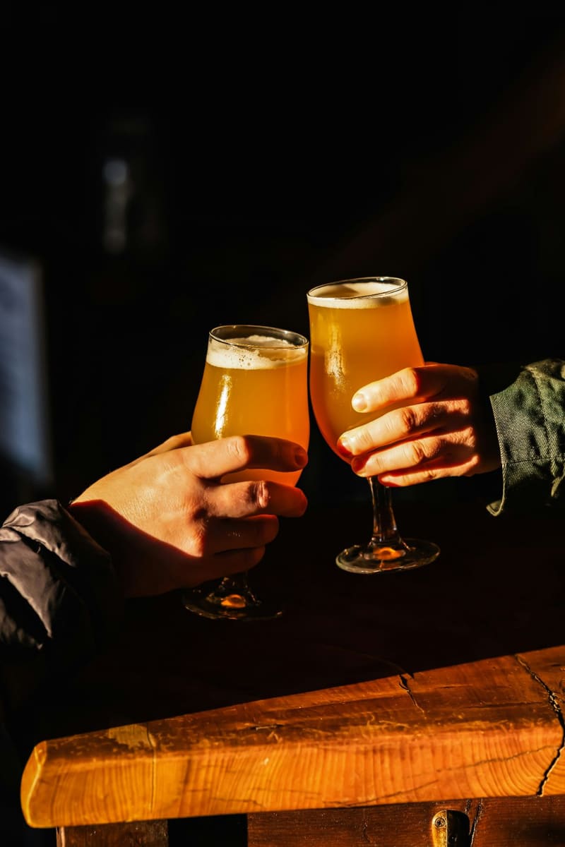 two beers being clinked