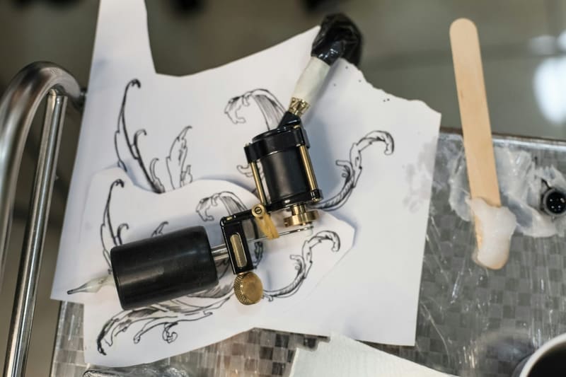 a tattoo machine on a stencil sheet