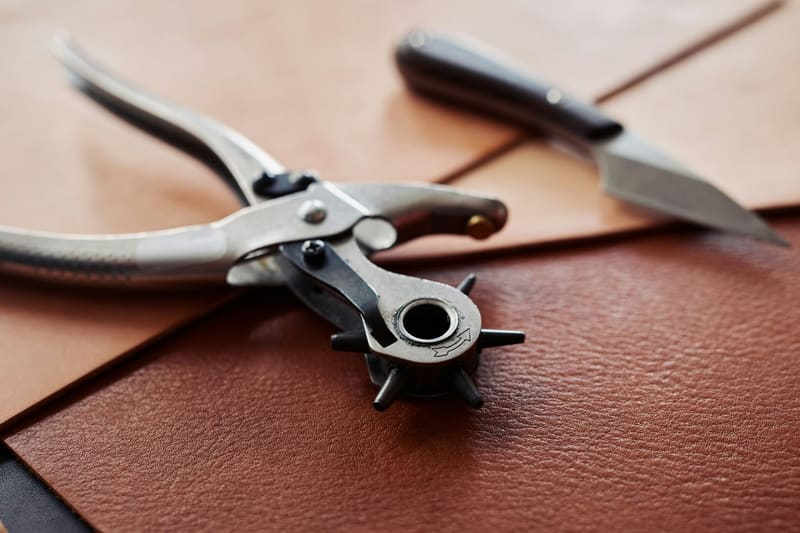 a leather hole punch and knife