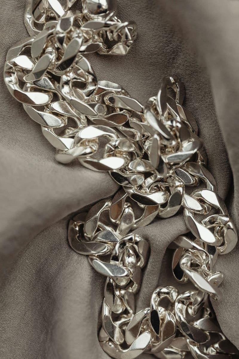 a heavy silver chain on silk