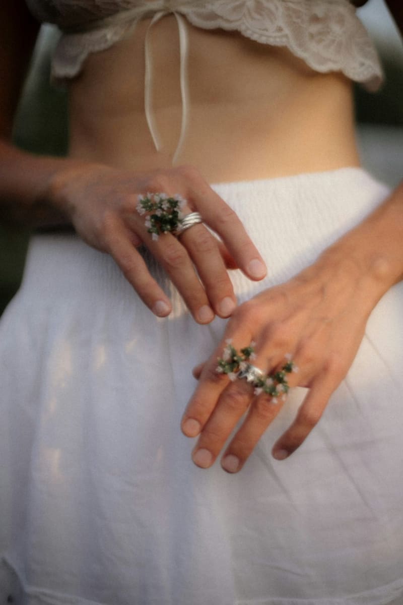 hands wearing cocktail rings